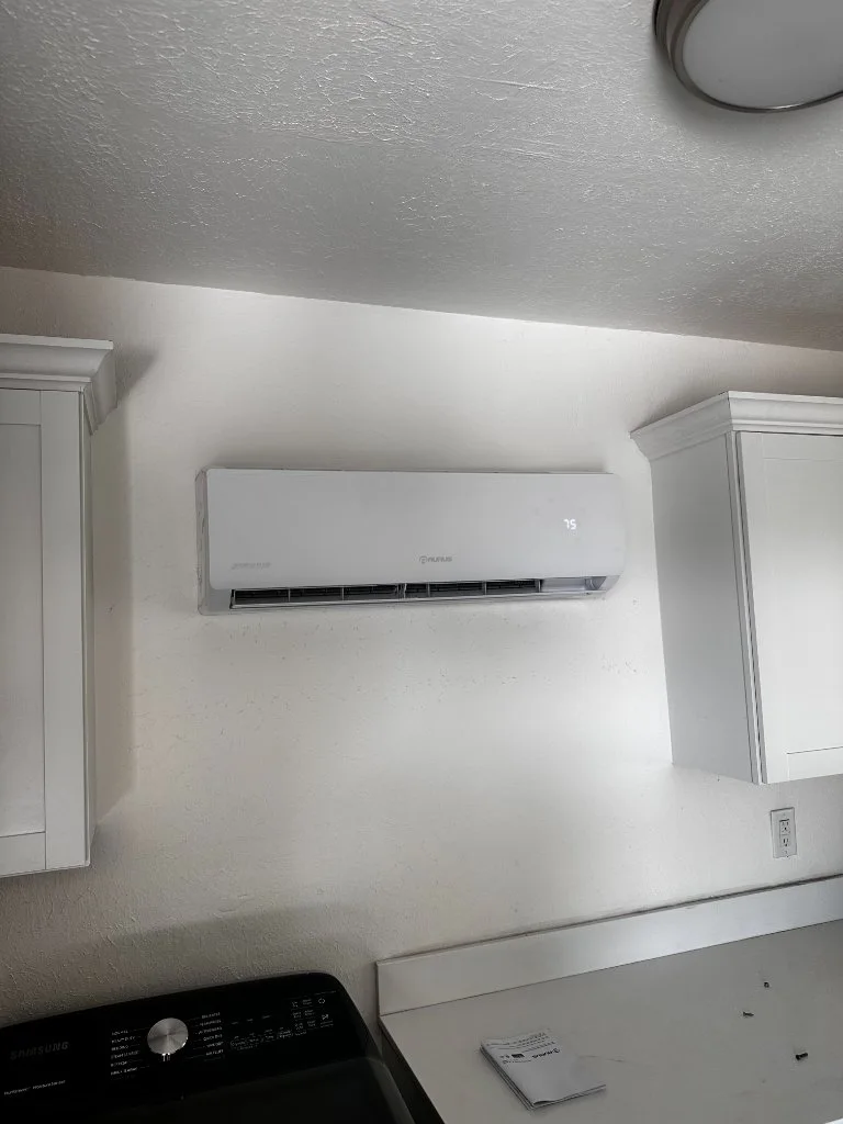 Wall-mounted mini-split inside a finished room