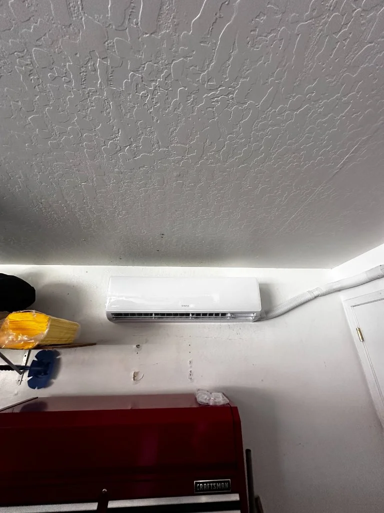 Wall-mounted mini-split cooling a garage