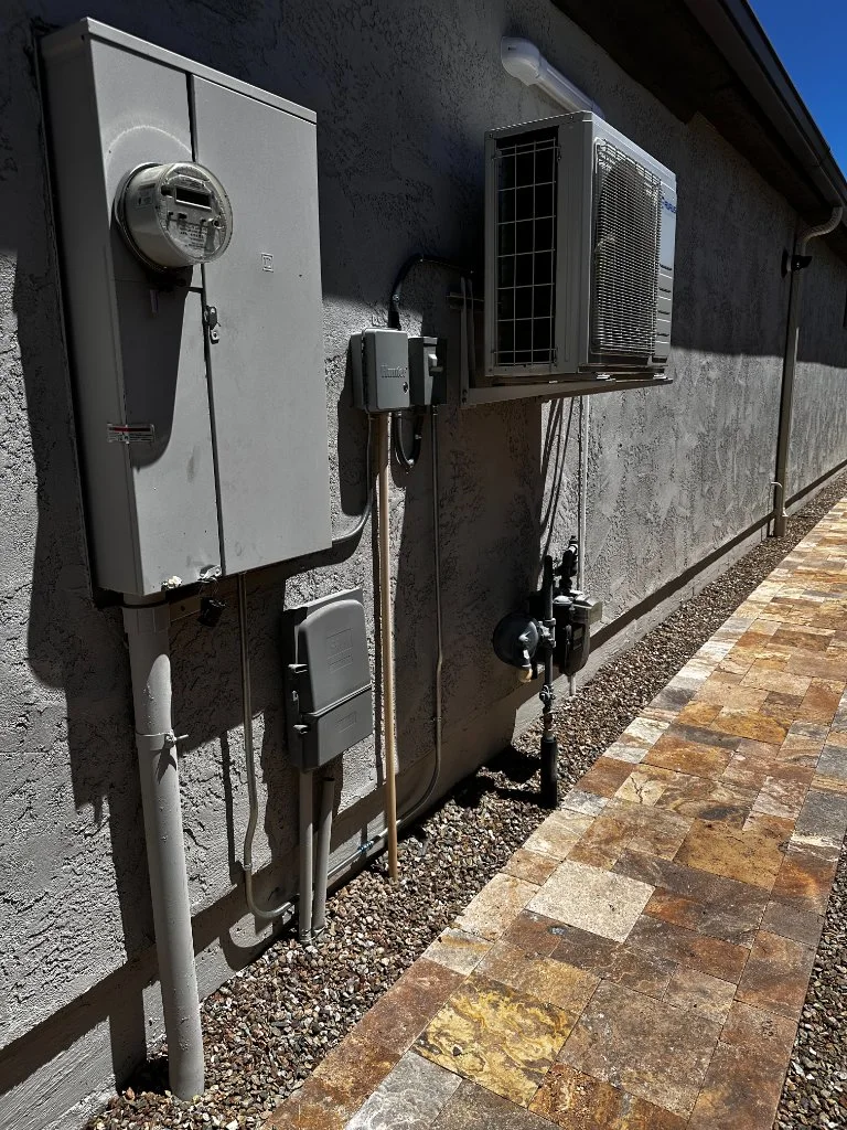 Two wall-mounted outdoor mini-split units