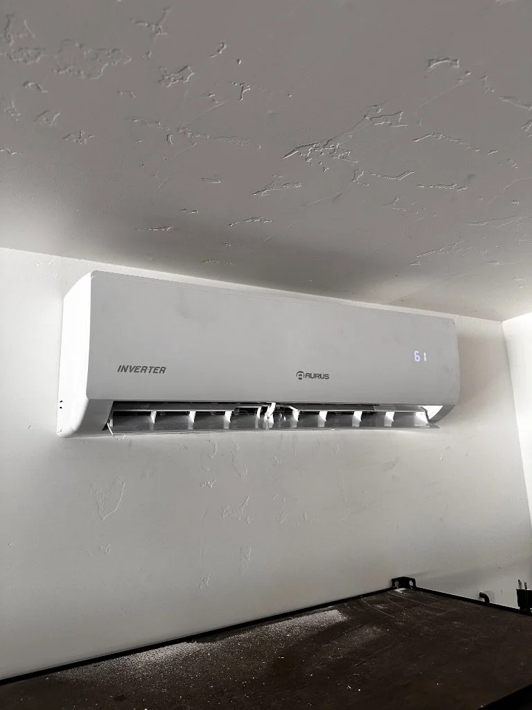 Wall-mounted mini-split in a garage workspace